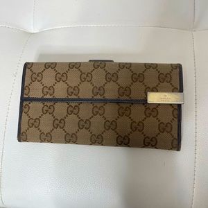 Authentic woman’s canvas Gucci wallet